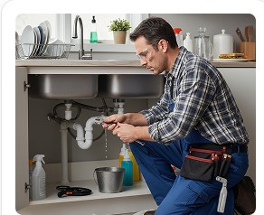 Plumber repairing a sink